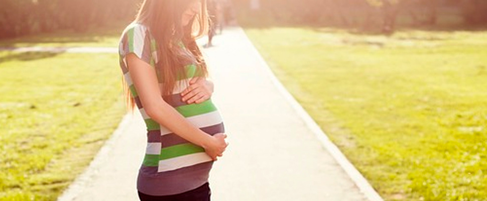 Pregnant woman in a park