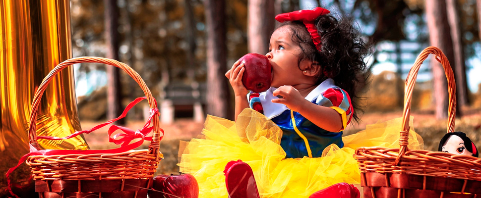 Girl wearing a Snow White costume.