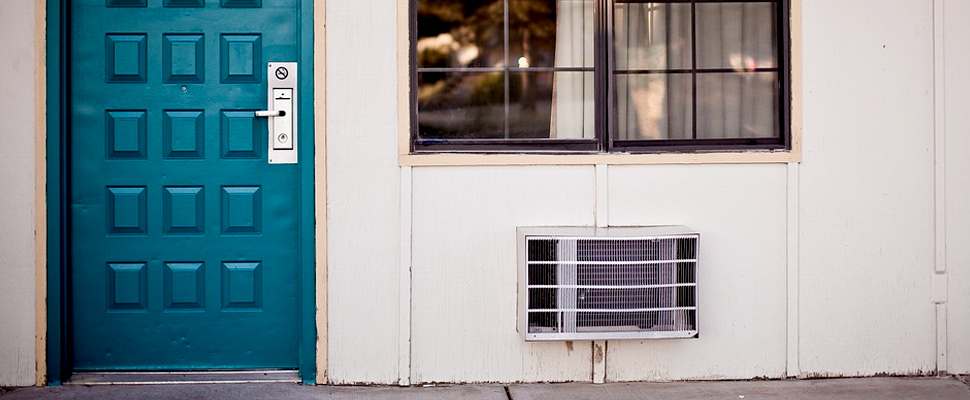 Air conditioning device outside a house.