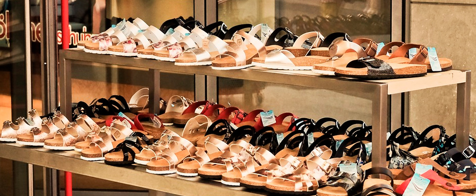 Store shelf with women's sandals.