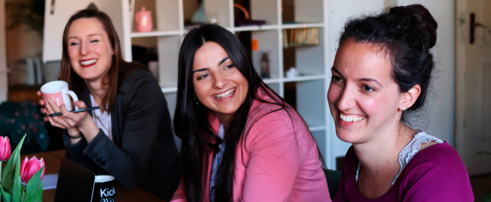 Three women during a meeting.