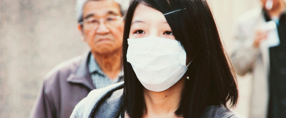 Woman wearing a mask.