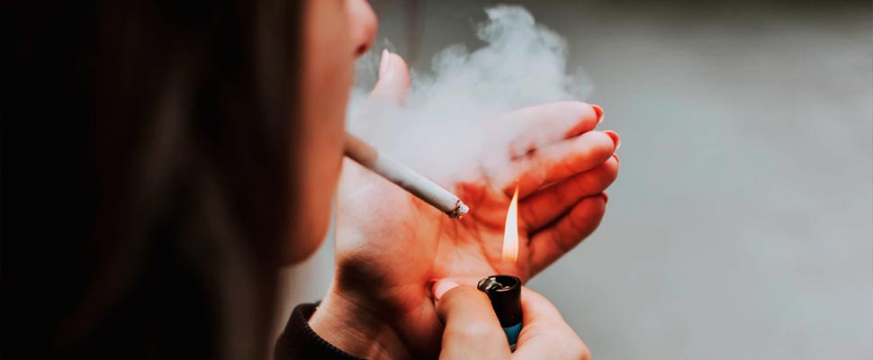 Woman lighting a cigarette