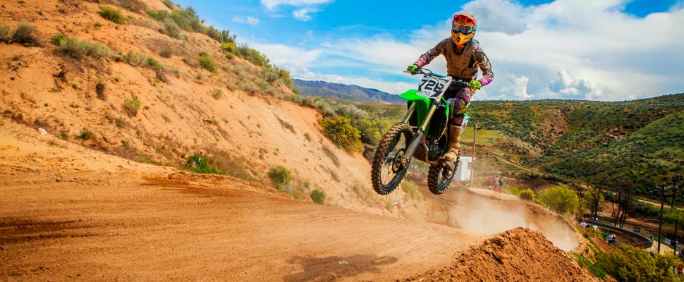 Man performing a motocross maneuver.