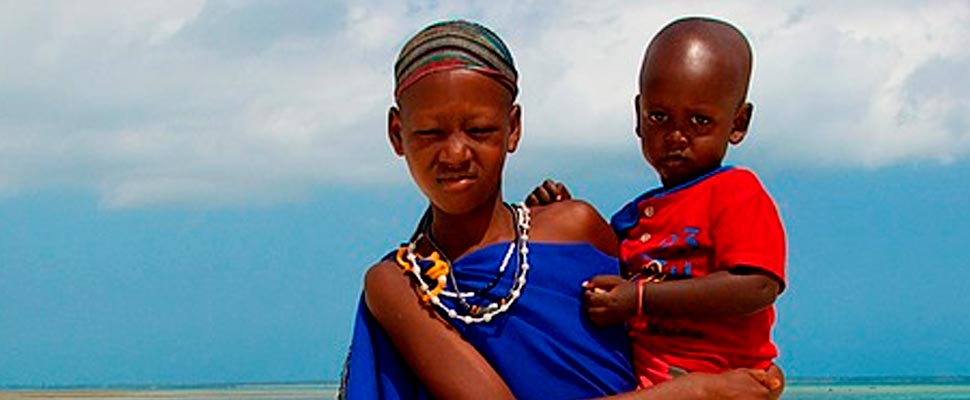 African woman carrying a child