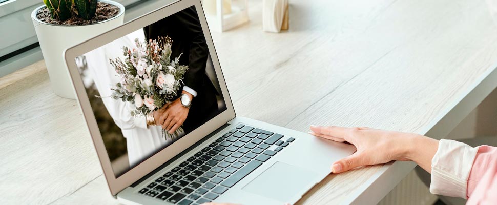 Photograph of a wedding on a laptop