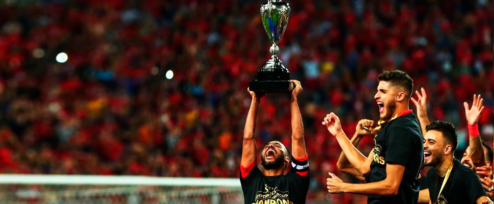 Al Ahly Cairo team players lifting the champions cup