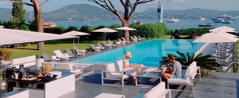 Two people near a hotel pool