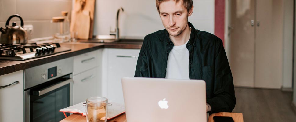 Man working from his kitchen