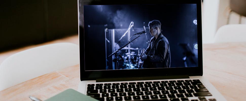 Computer with the image of a man playing guitar