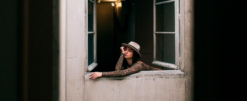 Woman leaning on a window