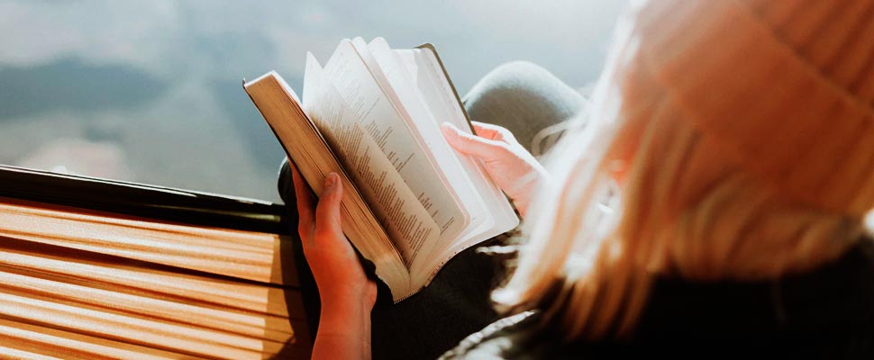 Woman sitting reading a book