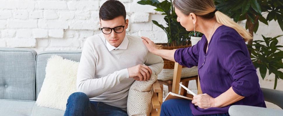 Psychotherapist in the middle of a session with a man