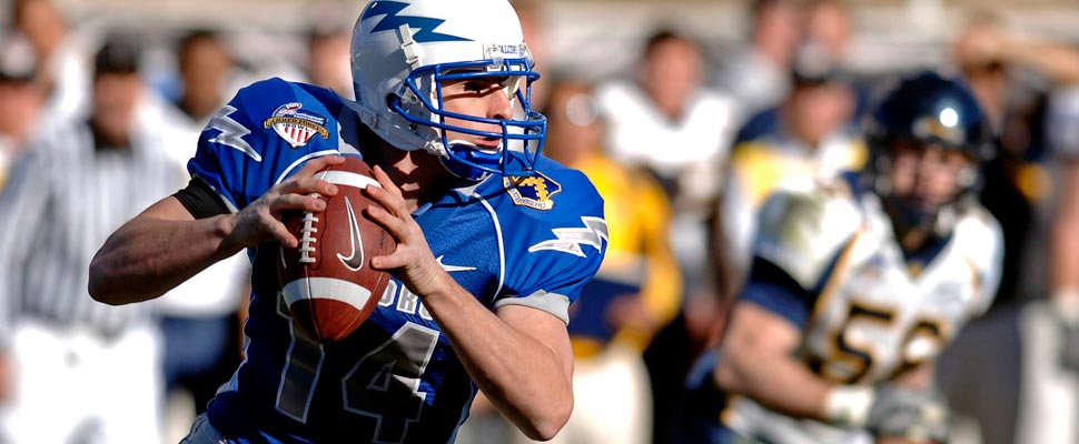 American football player throwing a ball.