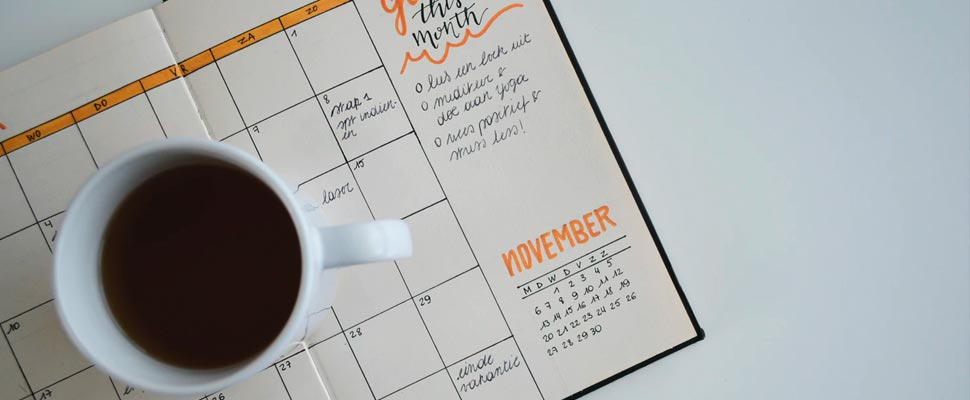 Cup of coffee on calendar