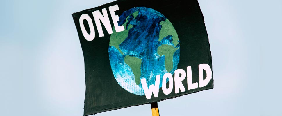 Poster with the phrase 'One World' and a drawing of the planet Earth