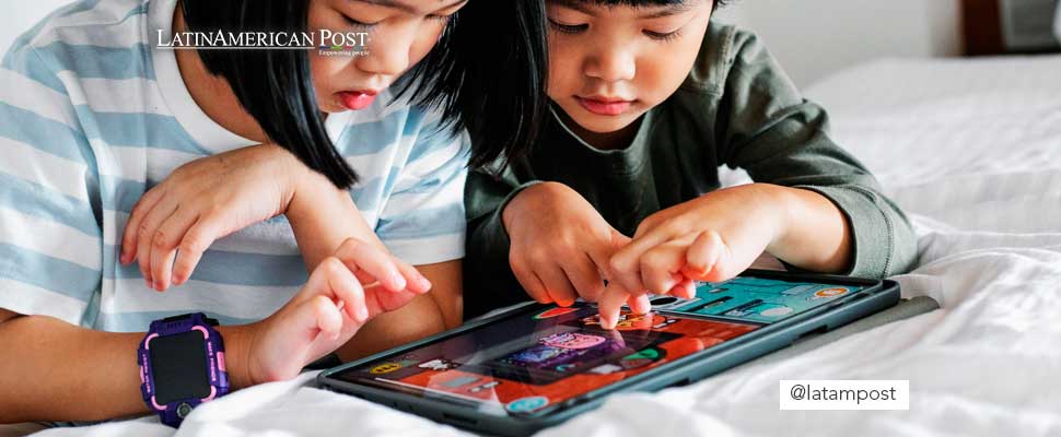 Children playing with a tablet