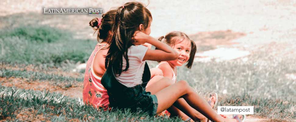 Children sitting on the grass