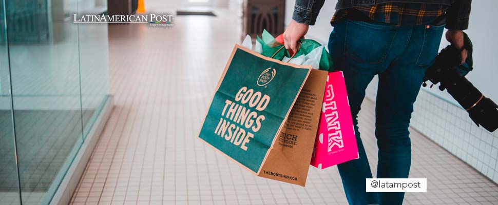 Person carrying bags in a supermarket