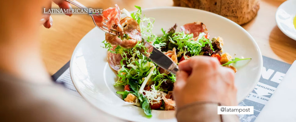 Person eating from a plate