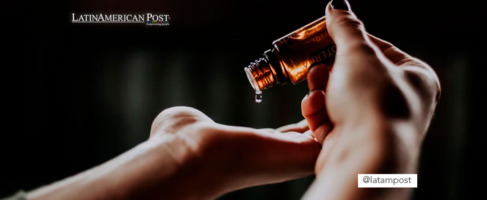 Woman applying CBD oil on her hands