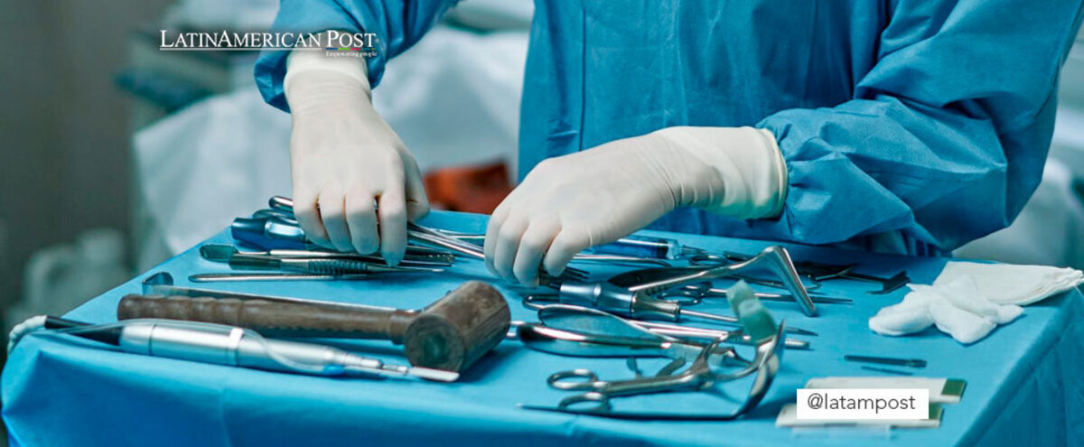 Woman holding medical equipment in an operating room