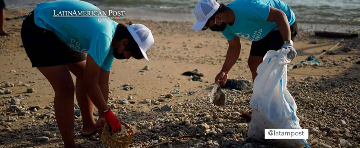 Couple picking up rubbish on a beach