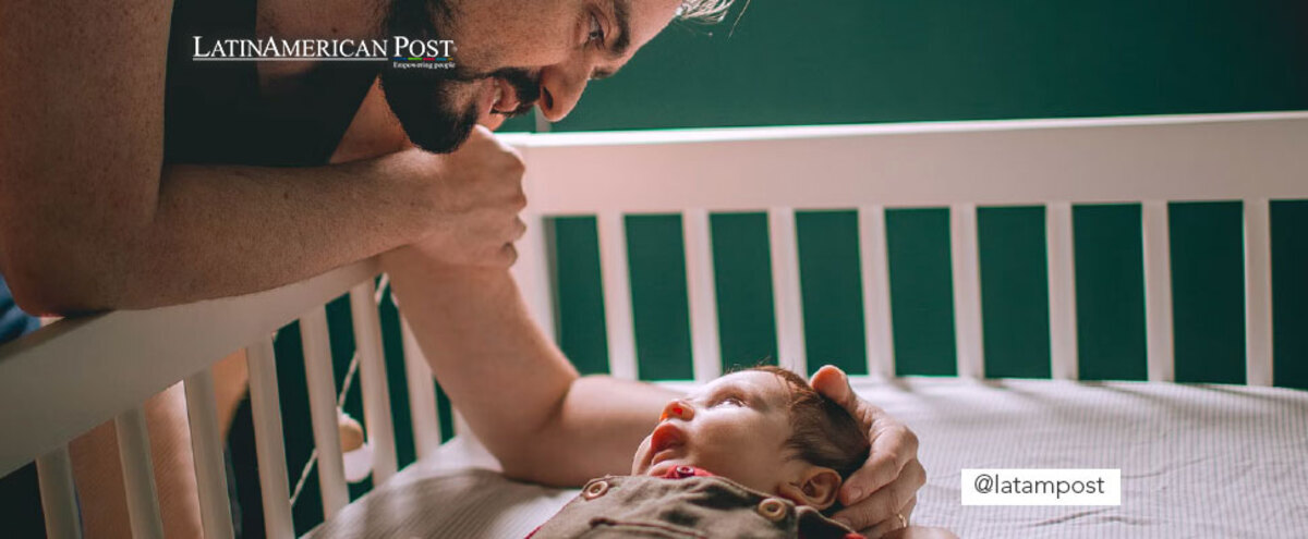 Father taking care of his son in a crib