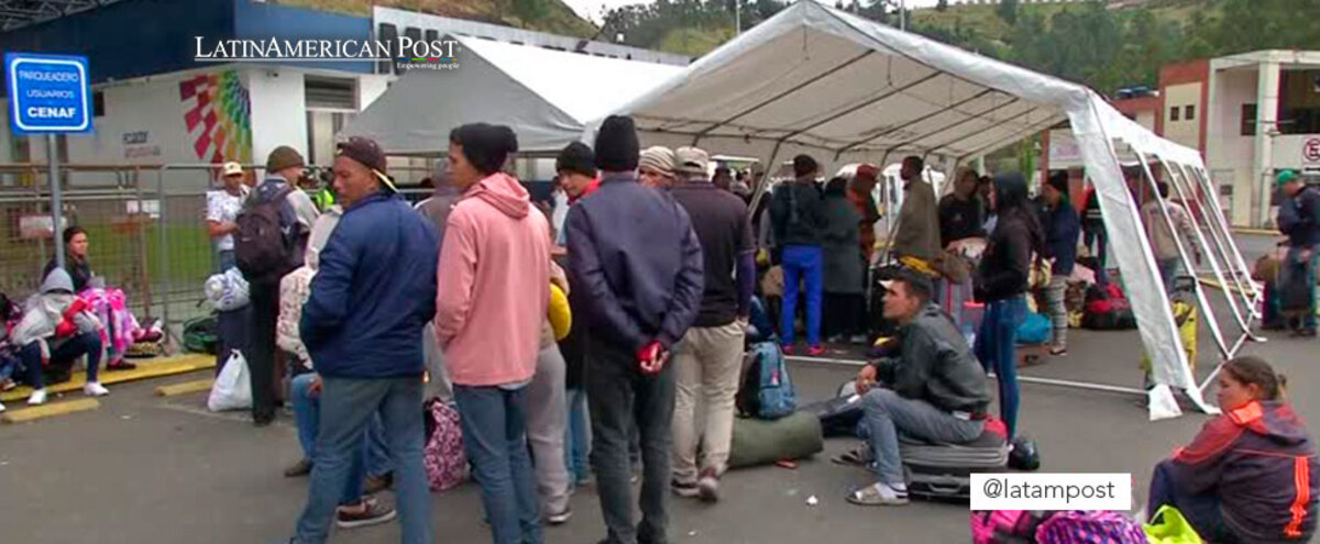 Migrants at a border with Ecuador