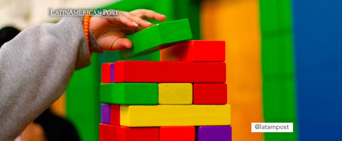 Boy stacking colored blocks