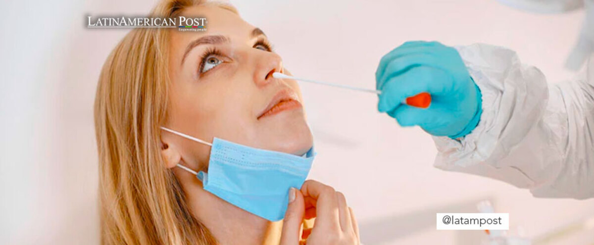 Woman performing nasal covid test