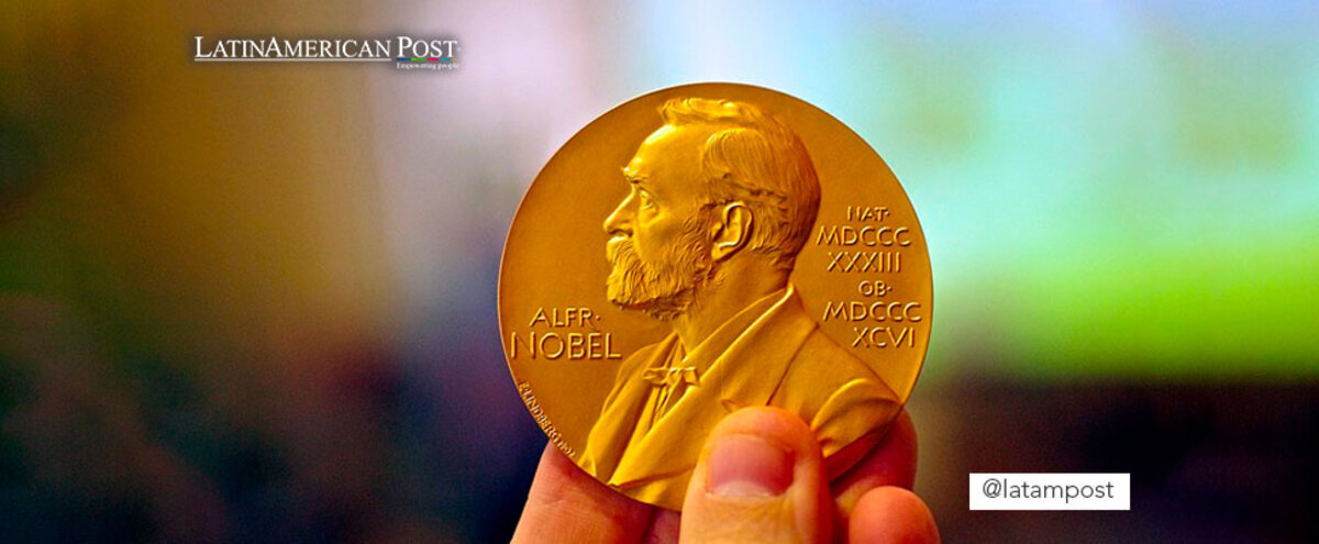 Hand holding a Nobel Prize medal