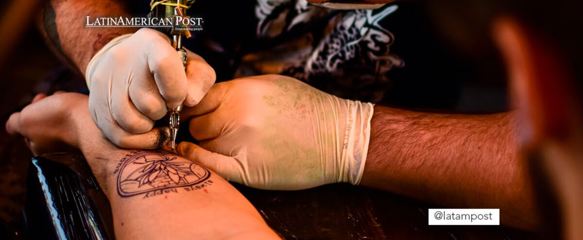 Man tattooing a forearm