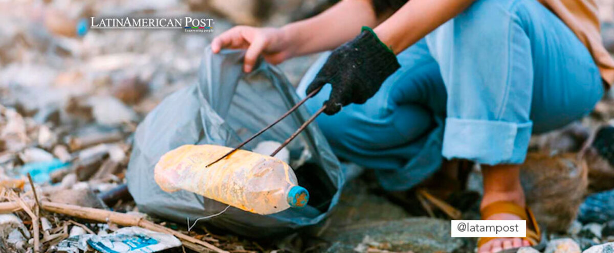 Volunteer picking up trash from a beach