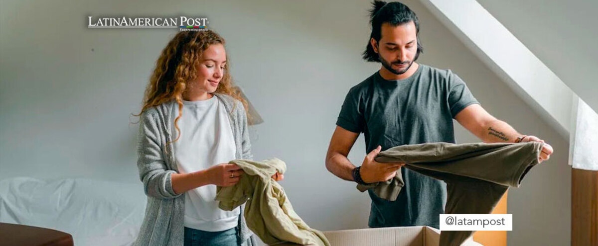 Couple packing belongings in boxes