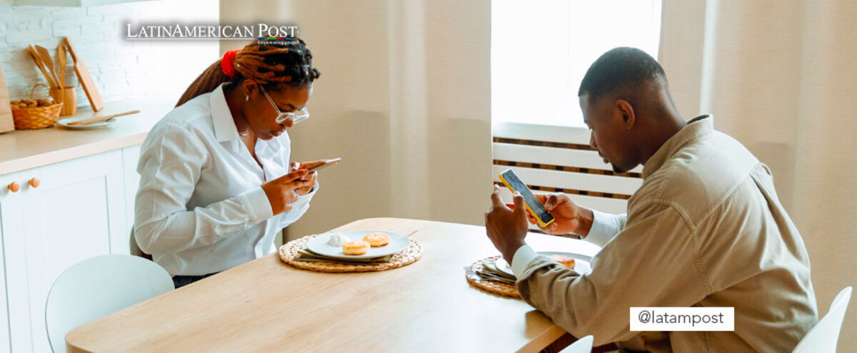 People at a dinner with cell phones