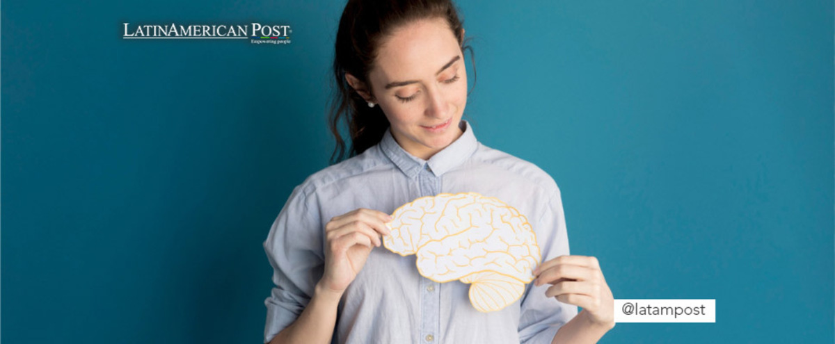 Woman holding a brain on paper