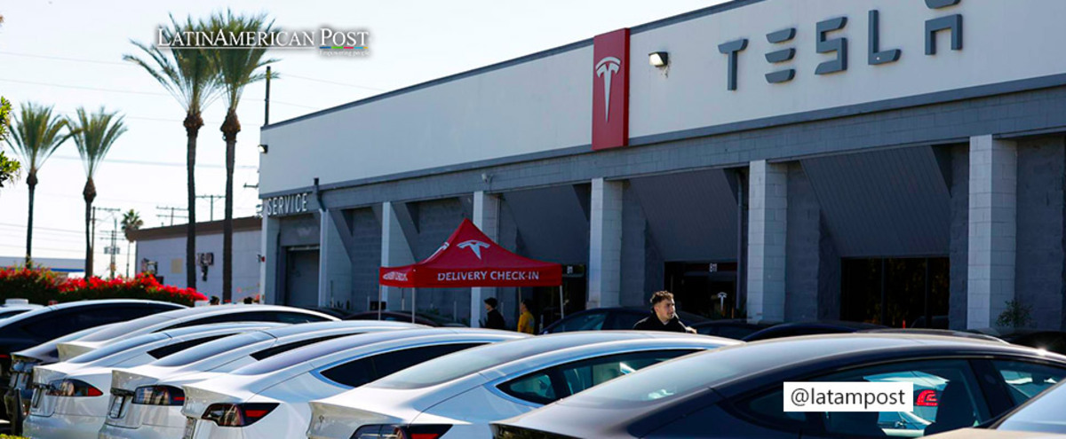 Cars sit on a lot at a Tesla showroom.