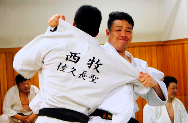 two men practicing judo