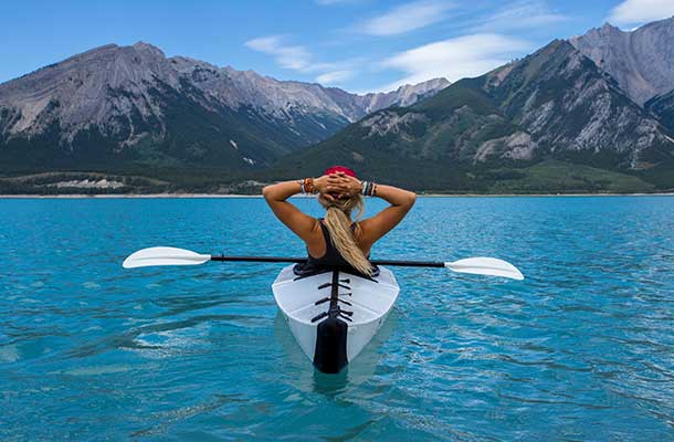 woman in a kayak watching the landscape