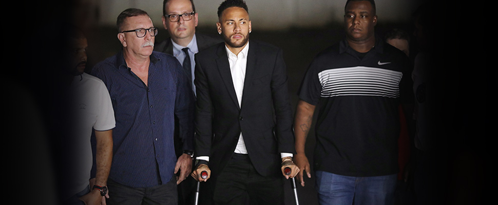 Brazilian soccer player Neymar leaves a police station in Sao Paulo