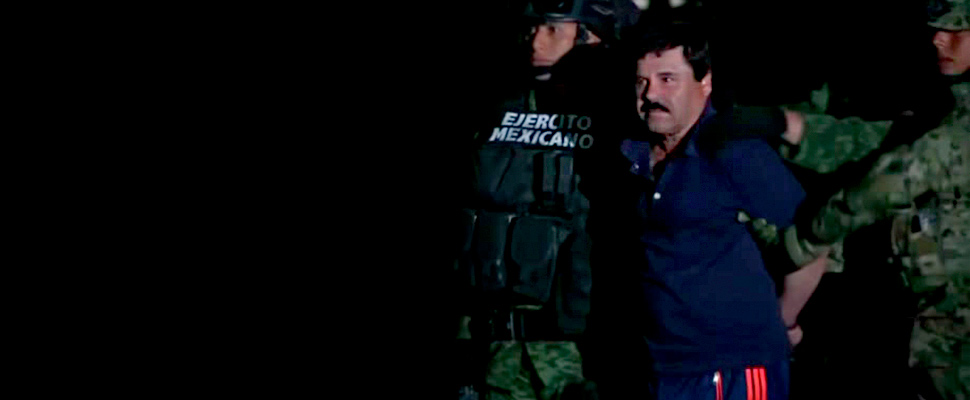 Acussed drug lord Joaquin 'el chapo' Guzman being walked from military vehicle