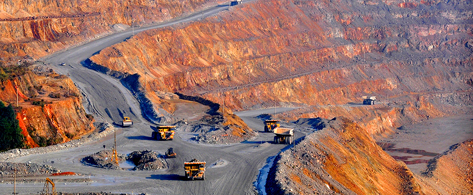 Trucks are seen at a copper mine of Jiangxi Copper in Dexing, Jiangxi province, China December 16, 2015.