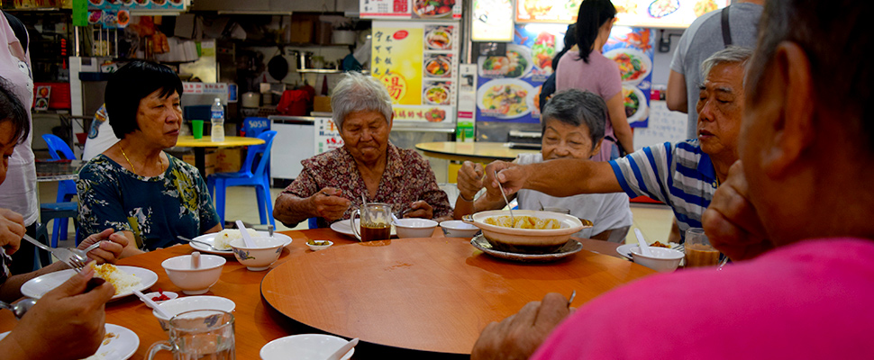 A group of elderly people at a lunch gathering organised by a charity in Singapore