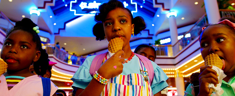 This image released by Netflix shows Priah Ferguson, center, in a scene from "Stranger Things."